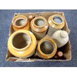 A box containing antique stone ware jars, cider bottles, hot water bottle.