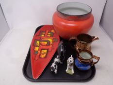 A tray containing assorted ceramics to include a shaped Poole plate, Poole dolphin,