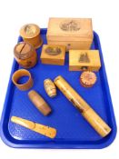 A tray of ten pieces of antique treen including boxes, napkin rings, money boxes, needle case,