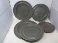 Five graduated antique pewter trays