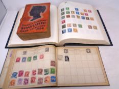 Two stamp albums containing 1000 world stamps 19th and 20th century together with a Stanley Gibbons