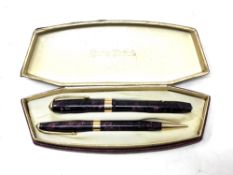 A boxed Conway Stewart fountain pen with 14ct gold nib and matching propelling pencil