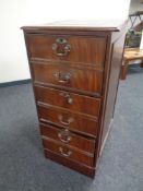 A mahogany three drawer filing cabinet with a tooled leather inset panel (a/f)
