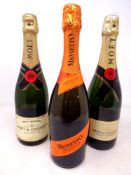 Two bottles of Moet and Chandon champagne together with a further bottle of Mionetto prosecco