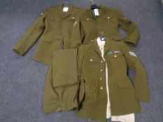 Three British army tunics together with a pair of trousers