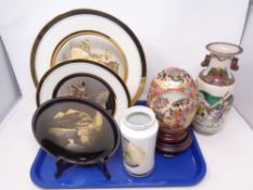 A tray containing Oriental wares to include Japanese gilded export plates on stand with vase,