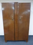 A mid 20th century oak double door wardrobe
