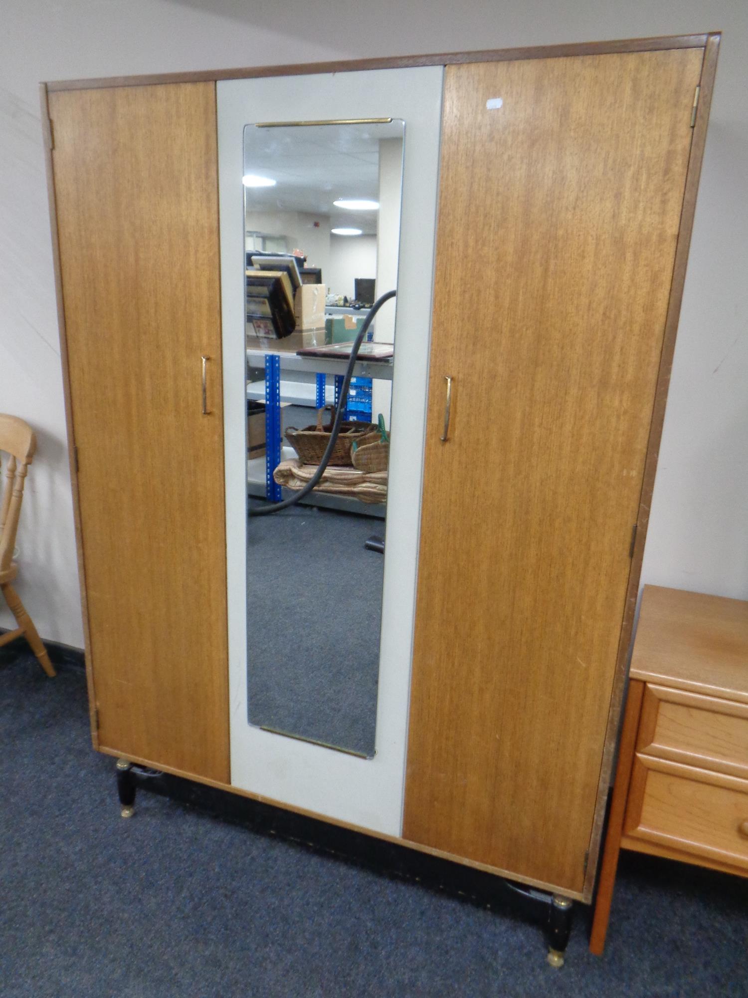 A mid 20th century teak G Plan E Gomme two-tone double door wardrobe