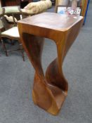 A sheesham wood twist column plant stand