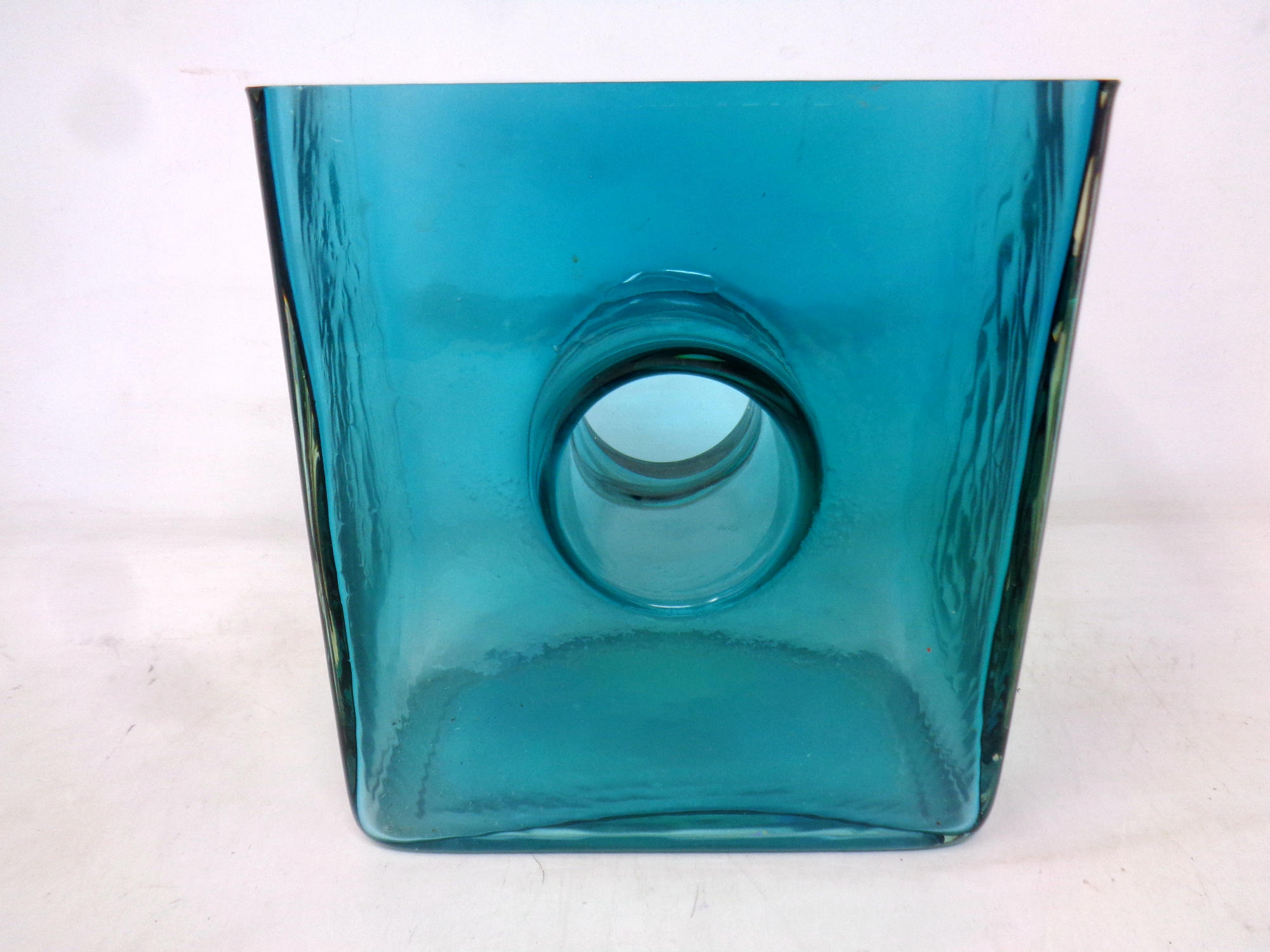 An art glass vase in the style of Christian Tortu with central hole (height 16.