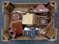 A box containing vintage cameras to include Brownie,