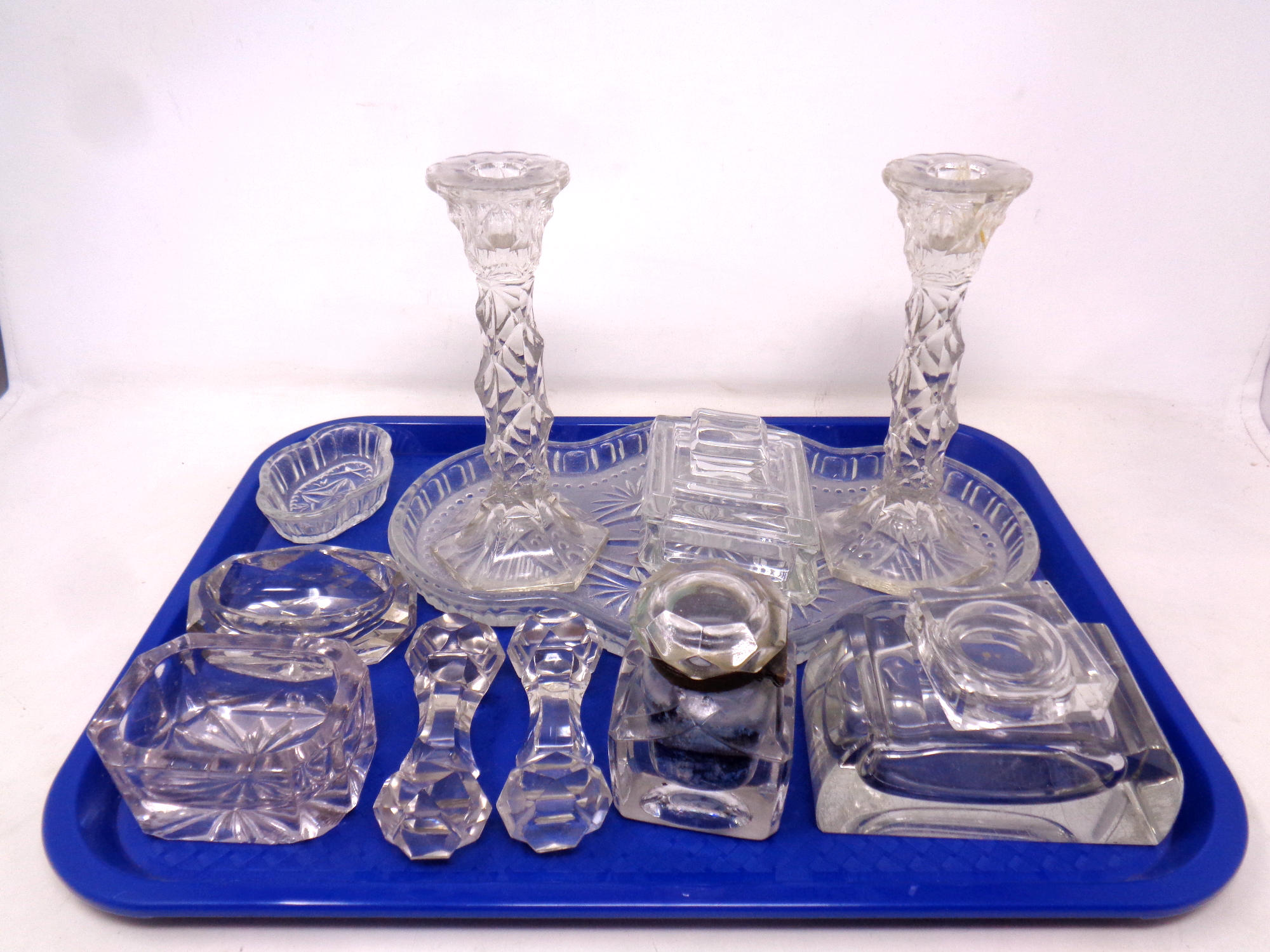 A tray containing antique and later glassware to include inkwells, knife rest,