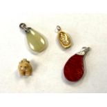 Four vintage pendants.