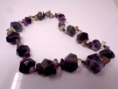 A multi stone decorative necklace.