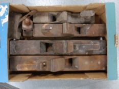 A box of vintage woodworking planes