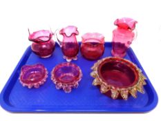 A tray containing seven pieces of antique cranberry glassware to include basket jugs,