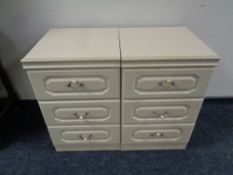 A pair of contemporary three drawer bedside chests