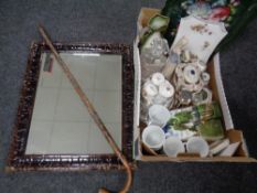 A framed bevel edged mirror together with a walking stick with metal badges and a box containing