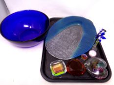 A tray containing assorted glassware to include heart shaped paperweights, blue glass bowl,
