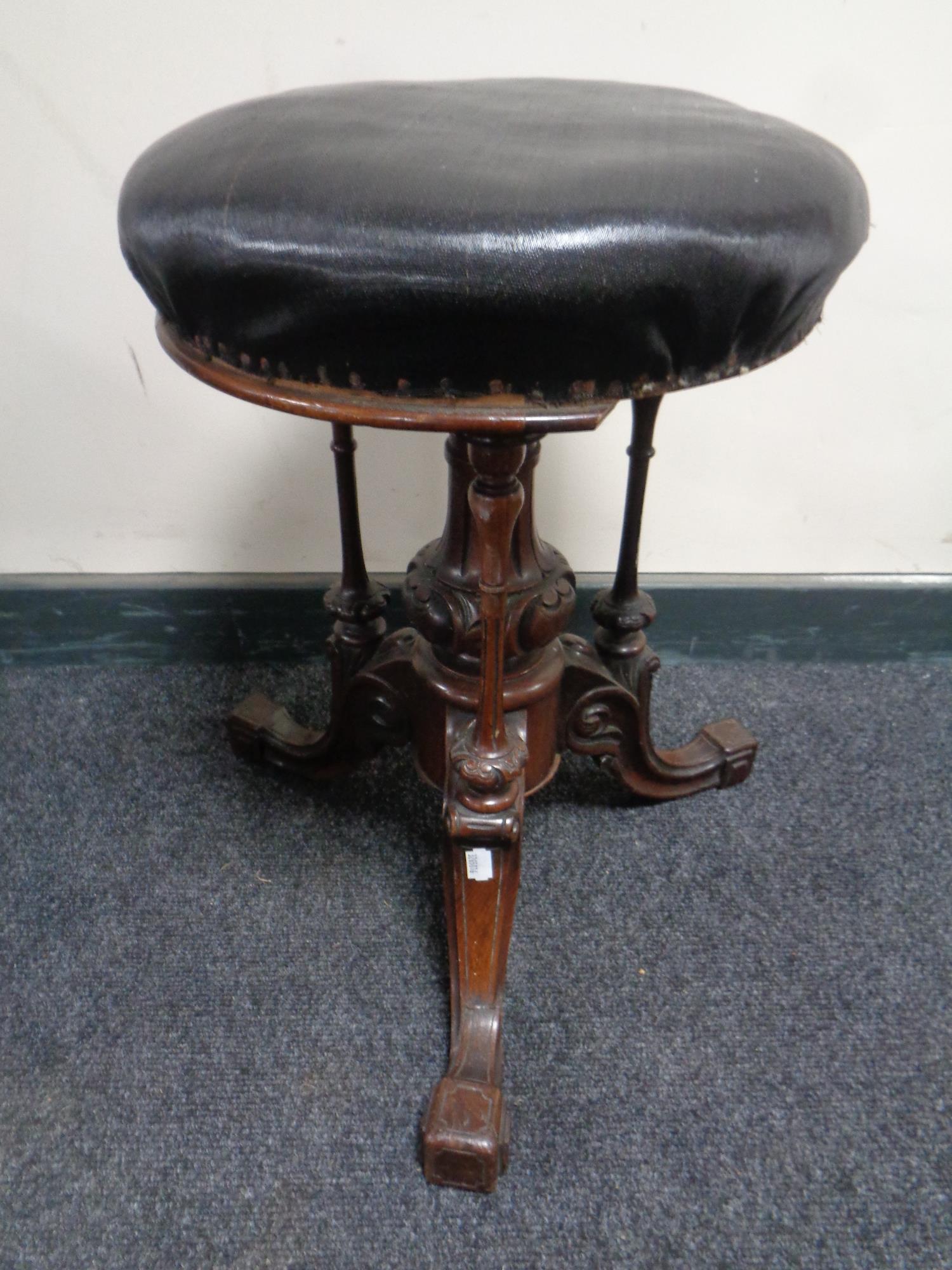 An early Victorian carved rosewood circular piano stool (a/f) CONDITION REPORT: One