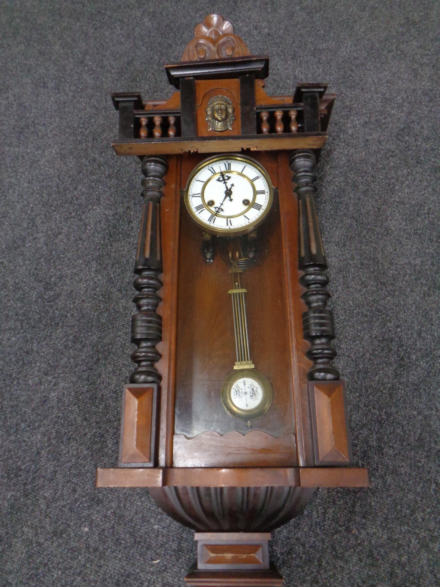 A mahogany cased Vienna style wall clock