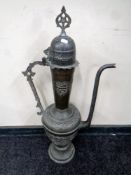 A middle Eastern oversized metal coffee pot (Height 82.