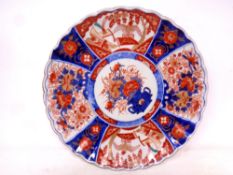 A Japanese Imari scalloped edged plate, diameter 30 cm.