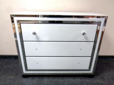 A contemporary Cimc home all glass three drawer chest