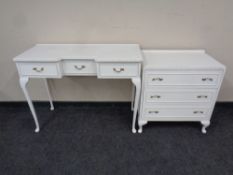 A white and gilt dressing table fitted three drawers together with a matching three drawer chest
