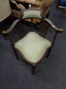An Edwardian inlaid mahogany corner chair with striped fabric seat