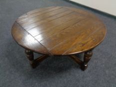 An oak circular coffee table