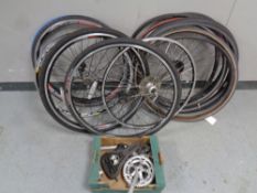 A box containing a large quantity of road bike wheels and tyres together with a further box