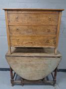 An Edwardian oak three drawer chest together with a Victorian oak gate leg table