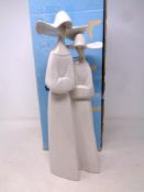 A Lladro figure of two nuns in box