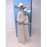 A Lladro figure of two nuns in box