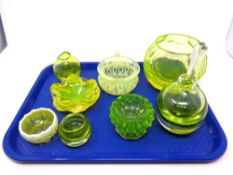 A tray containing eight pieces of uranium antique and later glassware to include dishes, vase,