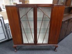 A mahogany Art Deco display cabinet on claw and ball feet