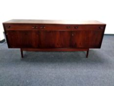 A 20th century Dalescraft teak low sideboard fitted cupboards and drawers