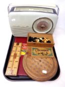A vintage Bush radio together with a boxed set of French Chessmen pieces, draughts pieces,