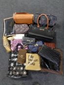 A crate of a large quantity of assorted lady's handbags and purses together with Harrods and