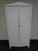 A contemporary painted double door nursery wardrobe fitted drawer beneath