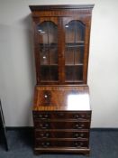 A reproduction inlaid mahogany bureau bookcase