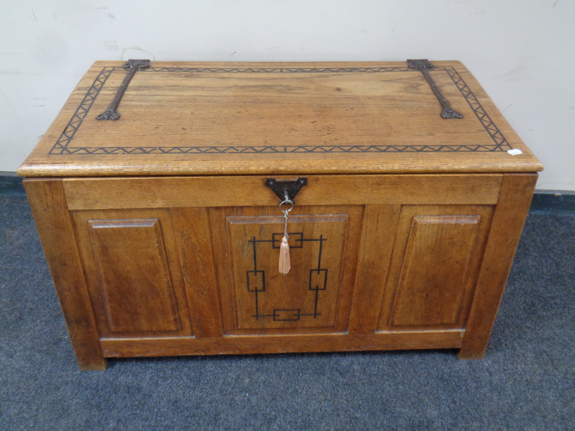 An Arts & Crafts oak coffer