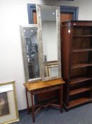 A reproduction mahogany hall table together with two contemporary framed mirrors