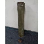 A large brass ammunition shell together with a part-exploded shell