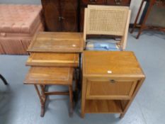 A nest of three yew wood tables together with a bedside stand fitted cupboard and a folding kitchen