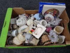 A box containing a quantity of assorted ceramics to include teapots, beer steins,