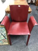 A late 20th century armchair upholstered in a Burgundy leather