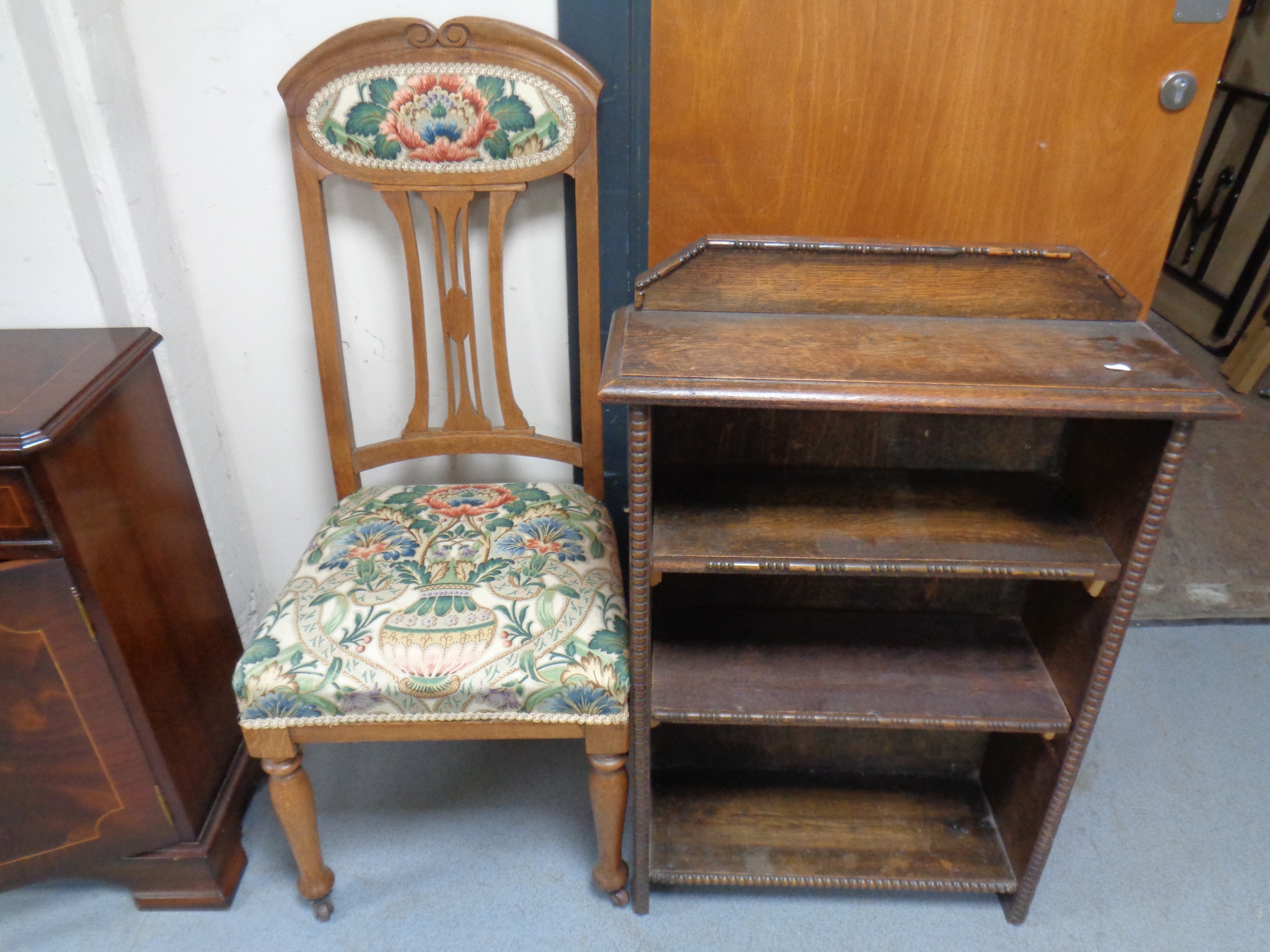 An Edwardian oak Arts & Crafts dining chair upholstered in a tapestry fabric together with a set of