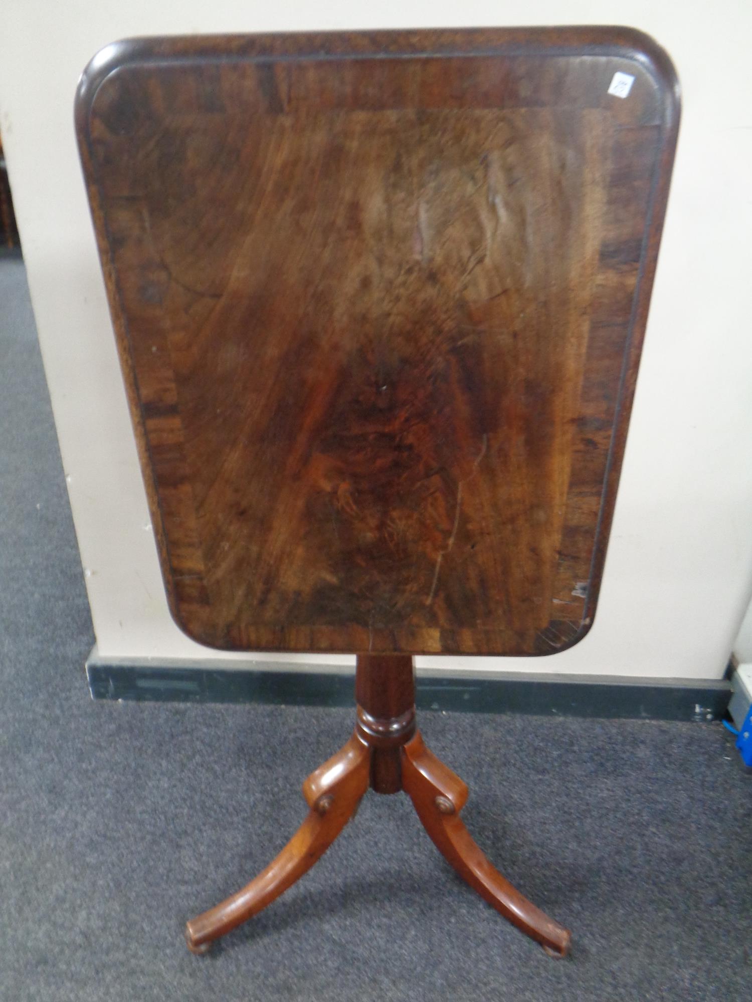 A Victorian mahogany rectangular tilt top pedestal occasional table
